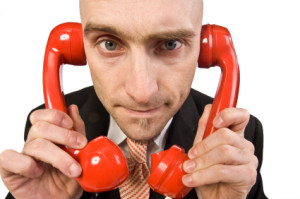 man-with-telephone-on-both-ears