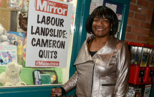 Diane-Abbott-MP-with-a-poster-predicting-something-most-doubt-will-happen