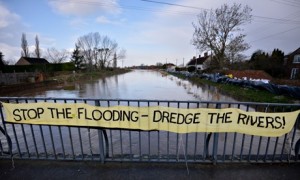 Floods defences : A banner asking for a return to dredging rivers to reduce the threat of flooding