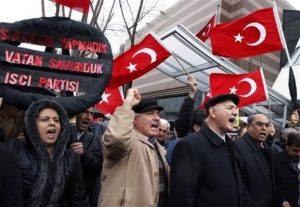 Leftist Turks shout slogans during a protest against the United States outside the U. S. embassy in Ankara, Turkey, Friday, March 5, 2010